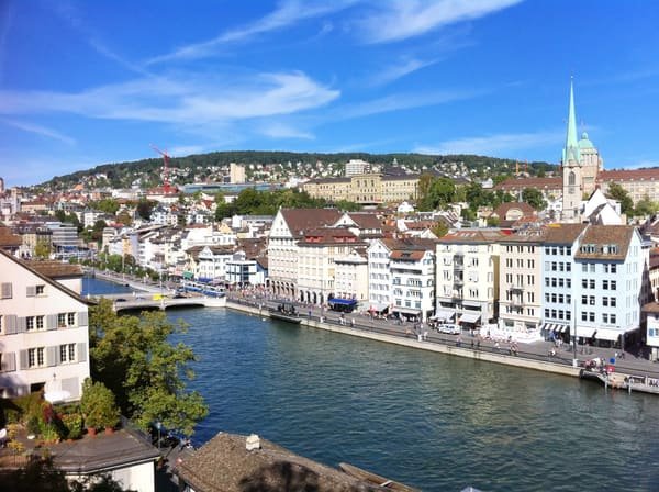 Zurich seen from the Lindenhof: the Limmat, its quays and the old town roofs